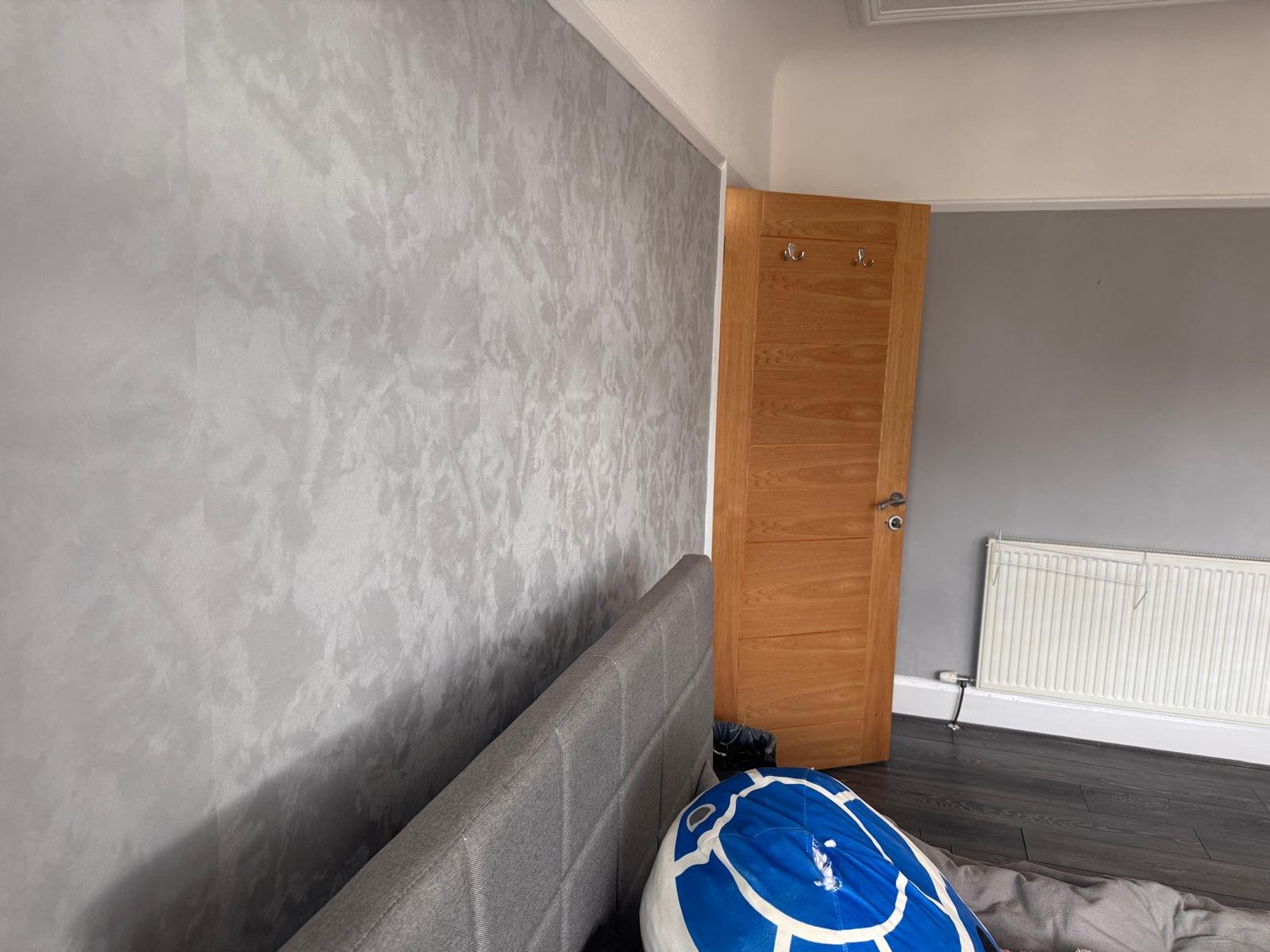 Bathroom with a grey polished microcement wall finish