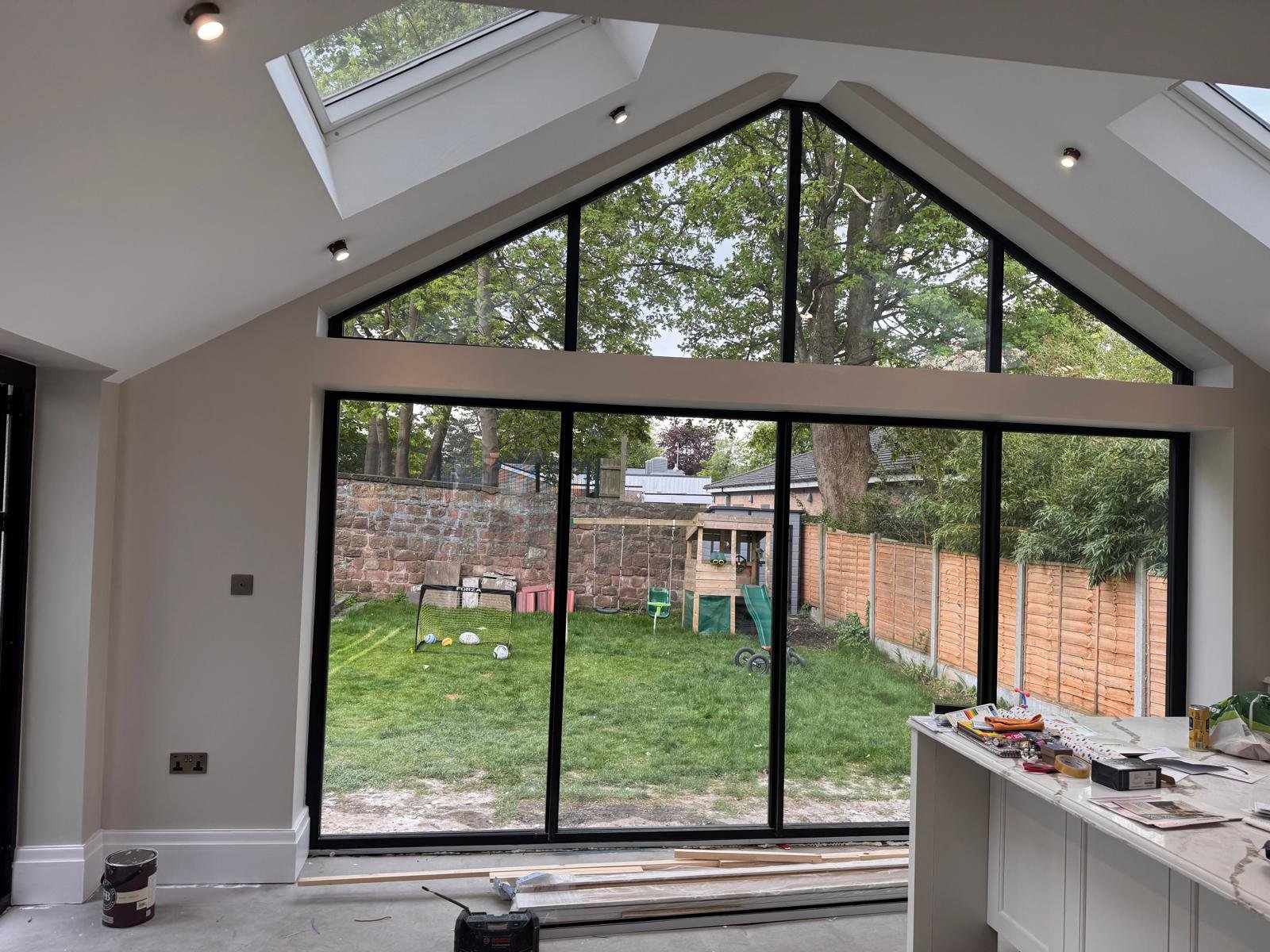 Vaulted extension with full height glazing, walls and ceilings decorated