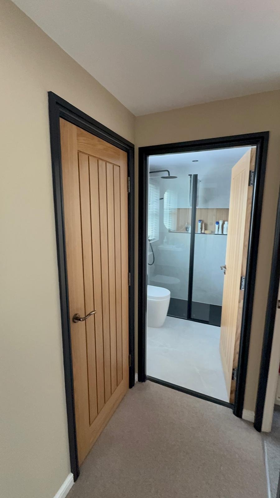 Hallway with an oak door and black painted door frames